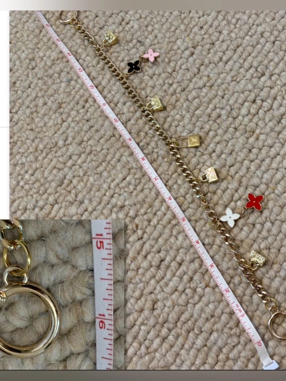 Authentic Louis Vuitton Lock Charm and other unbranded charms on bag chain